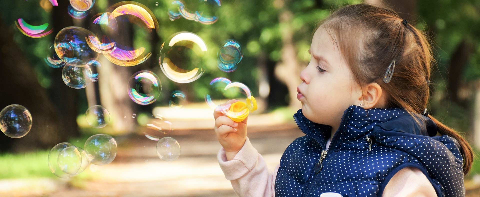 Kid PLaying Bubbles in California - KidsCarDonations.org