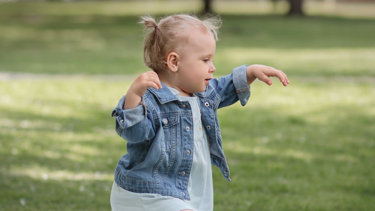 Shallow Focus of a Cute Baby on Picnic Blanket | Kids Car Donations