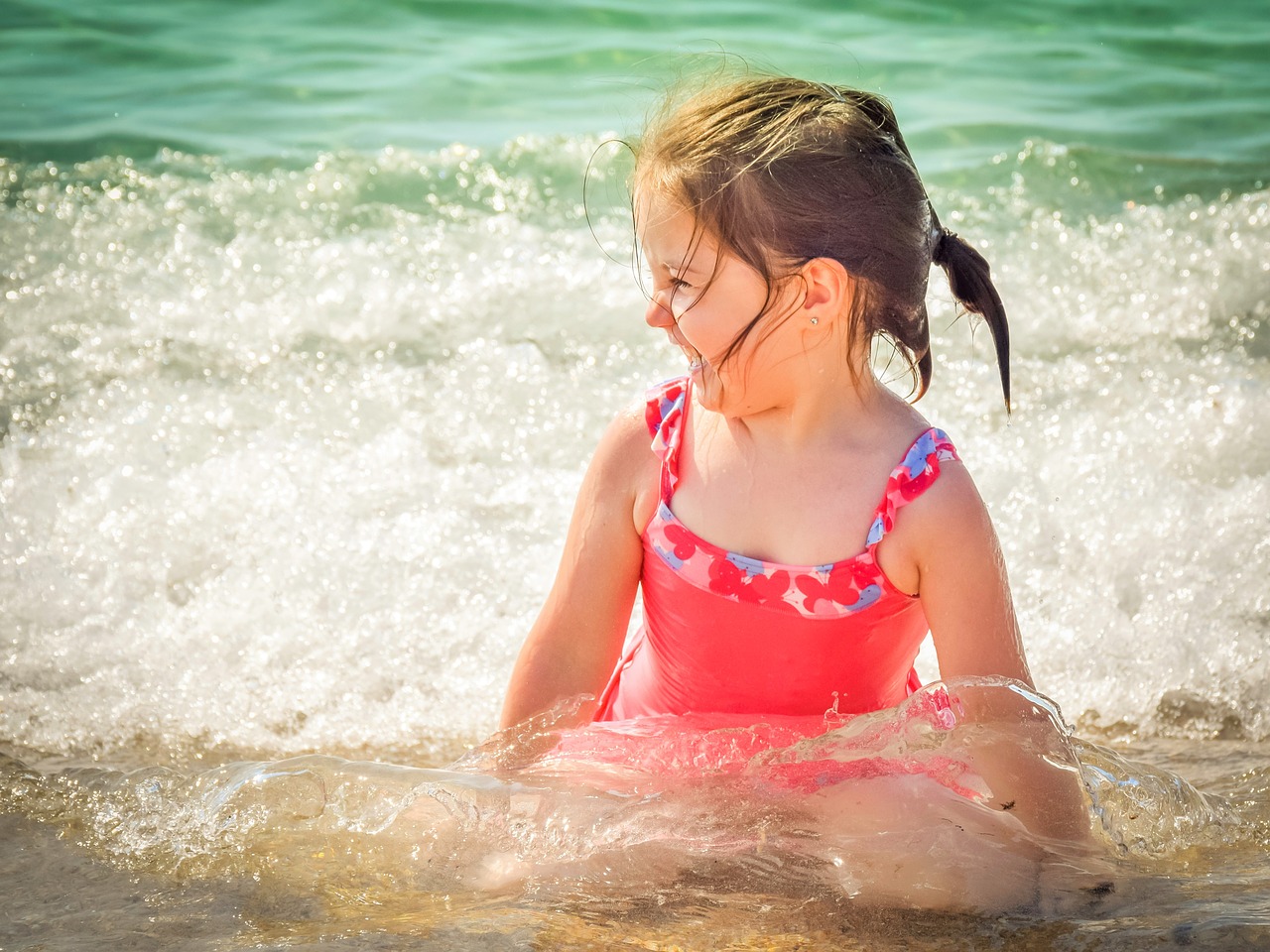 Little Girl Playing at the Beach Kids Car Donations.