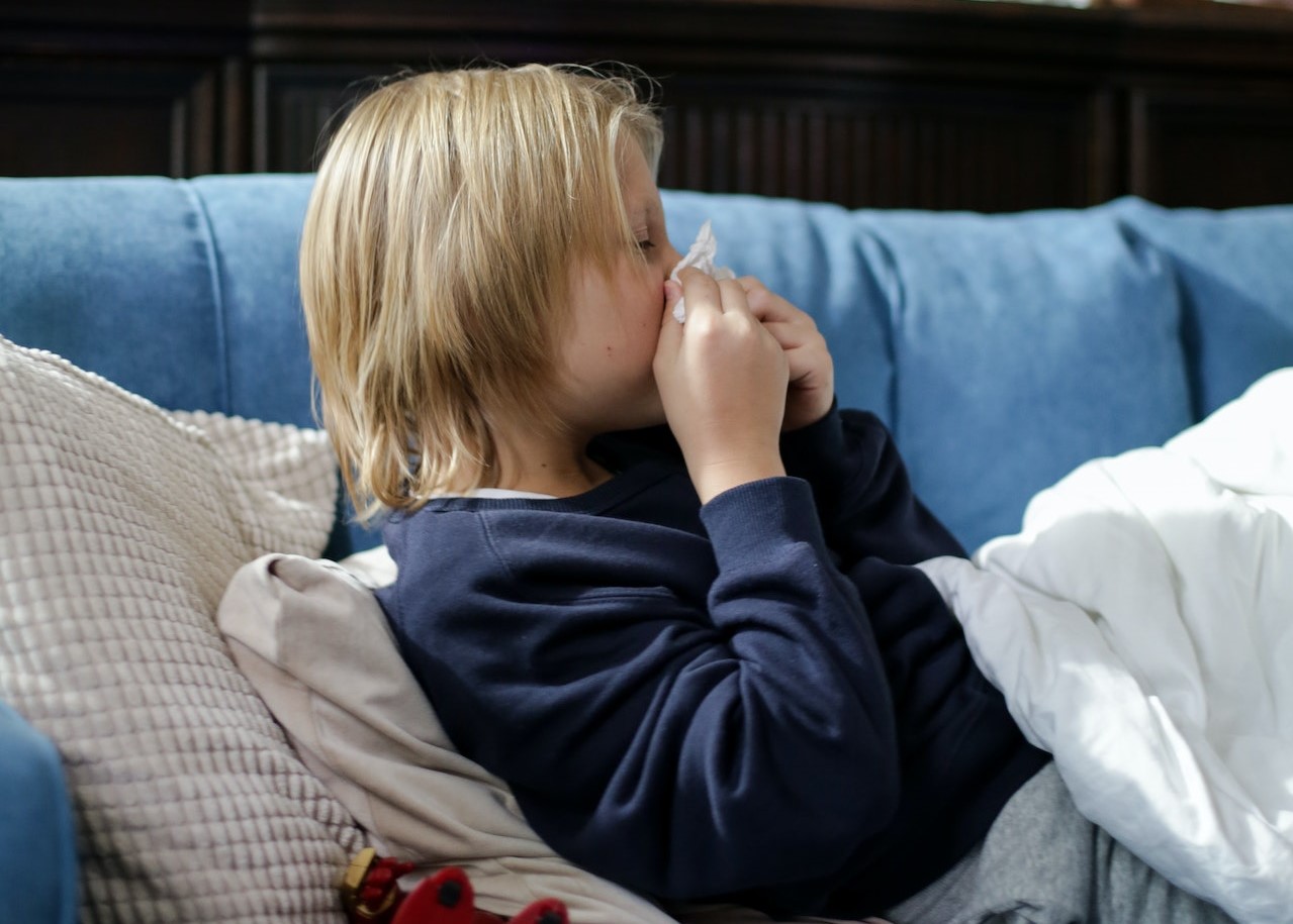 Sick Child Wiping His Nose with Tissue | Kids Car Donations