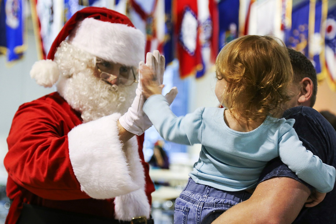 Kid And Santa High-Five | Kids Car Donations
