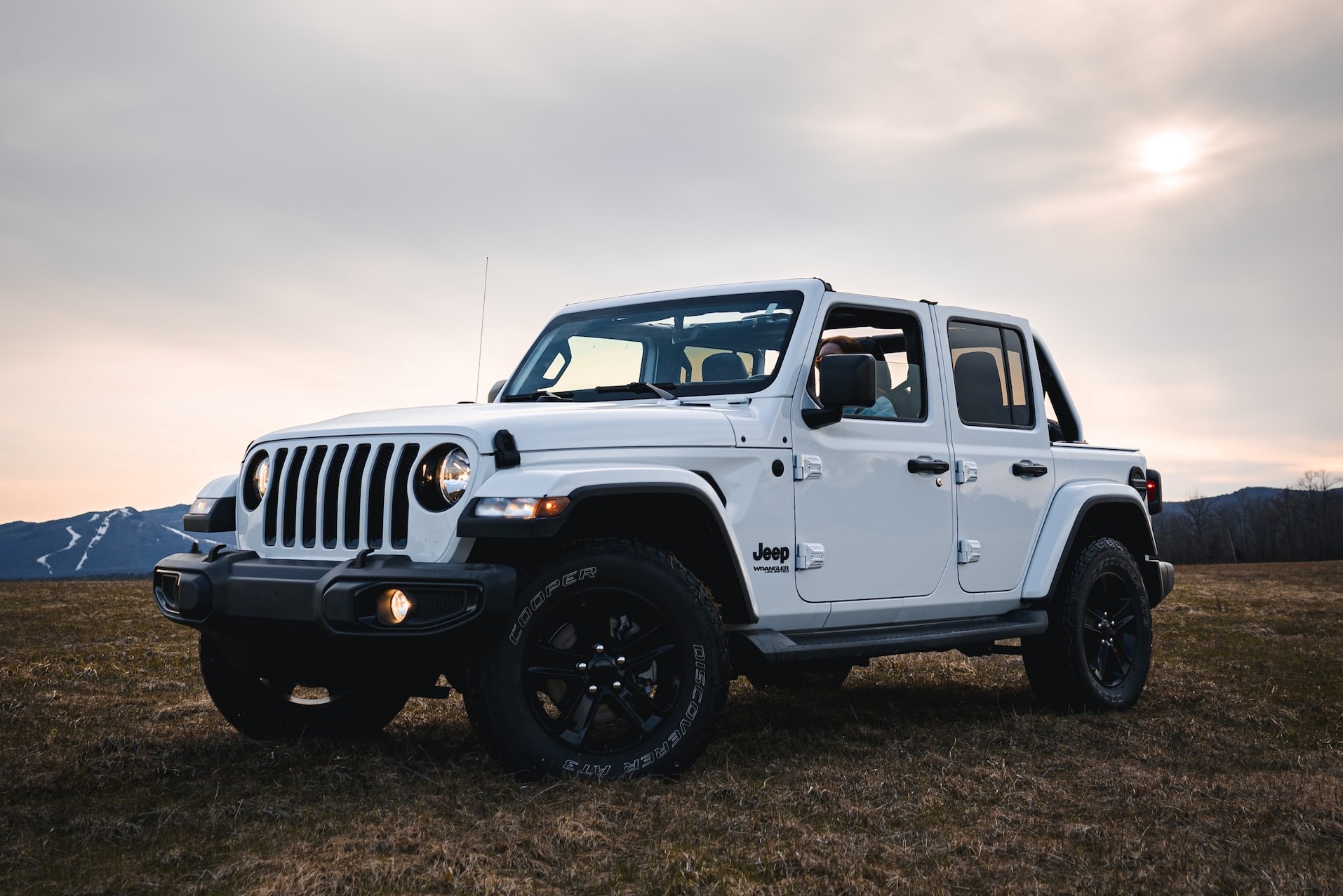 white jeep wrangler on green grass | Kids Car Donations