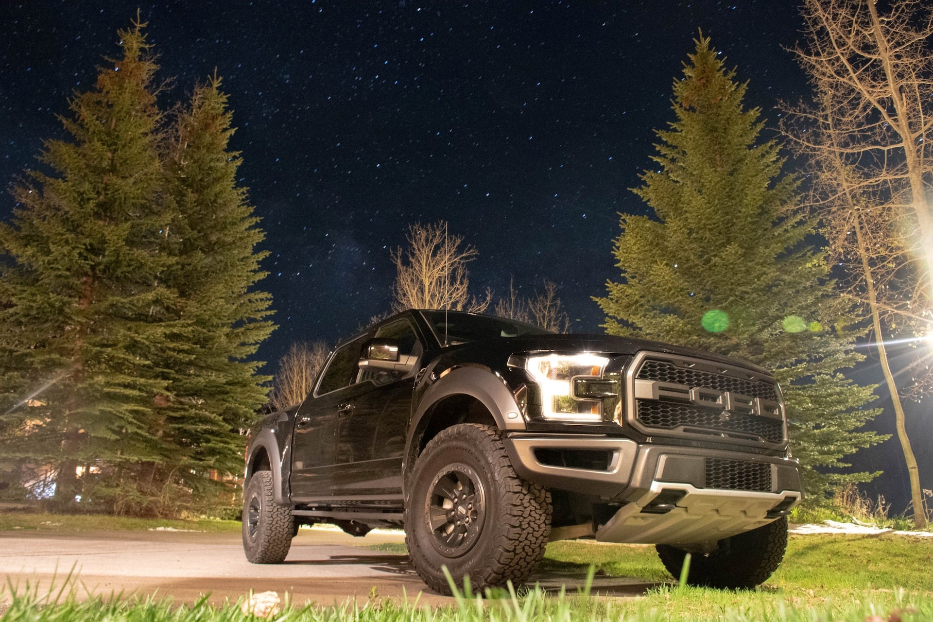 black suv on green grass field during night time photo | Kids Car Donations