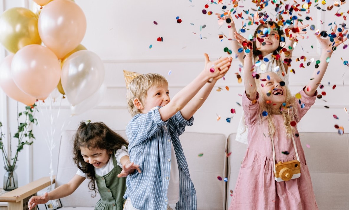 A Children Playing with Confetti in a Party | Kids Car Donations