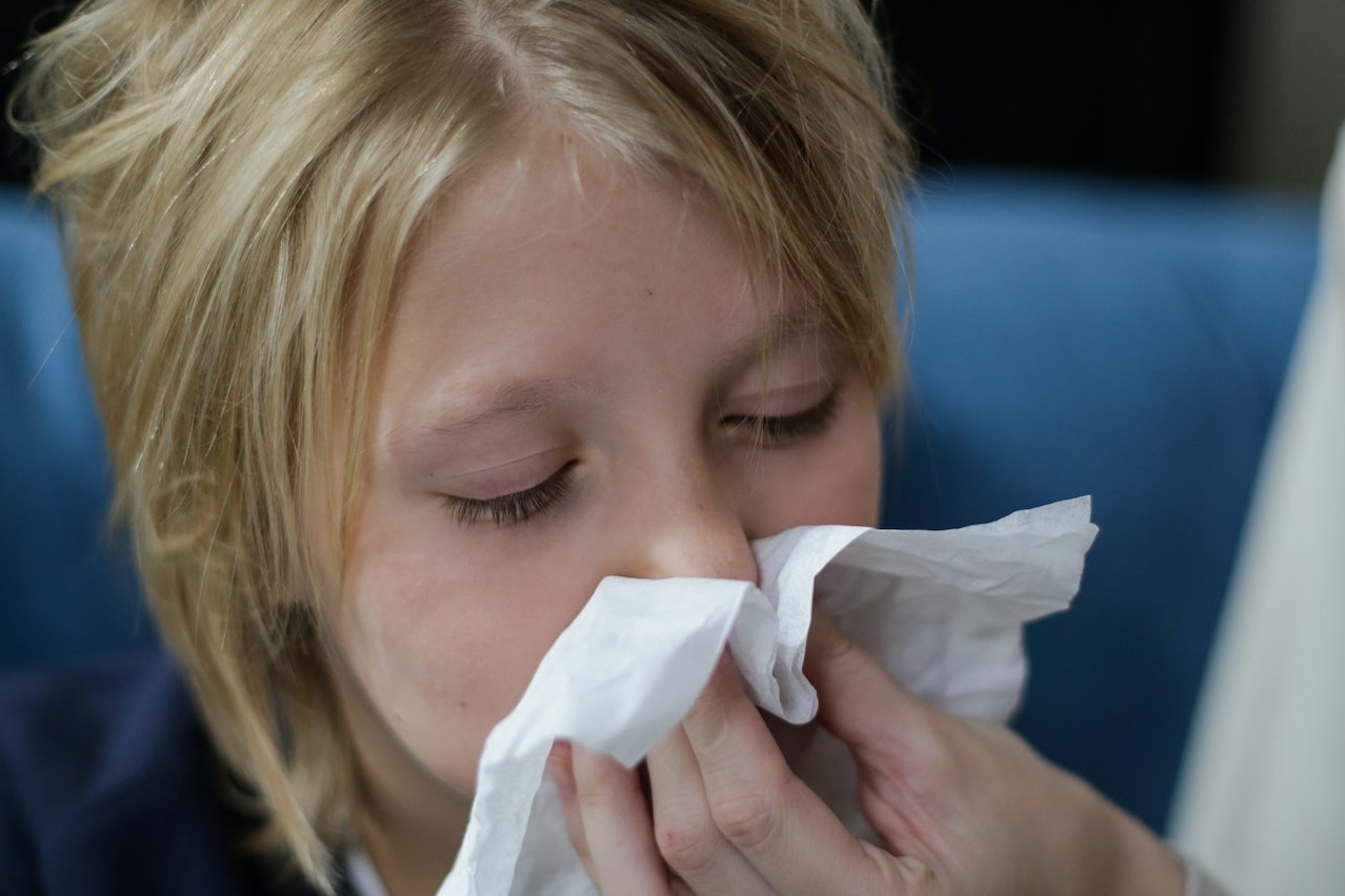 Sick Child Wiping His Nose with Tissue Pexels License