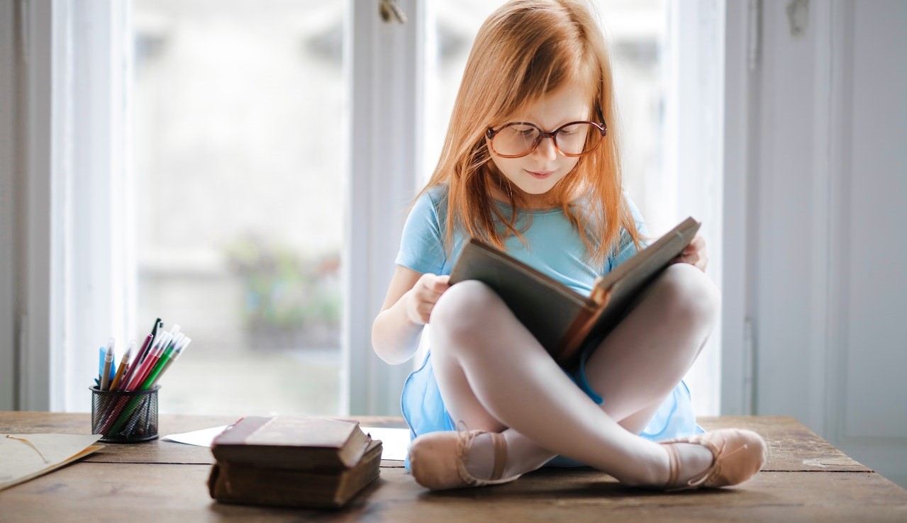 Photo Of Girl Reading Book | Kids Car Donations