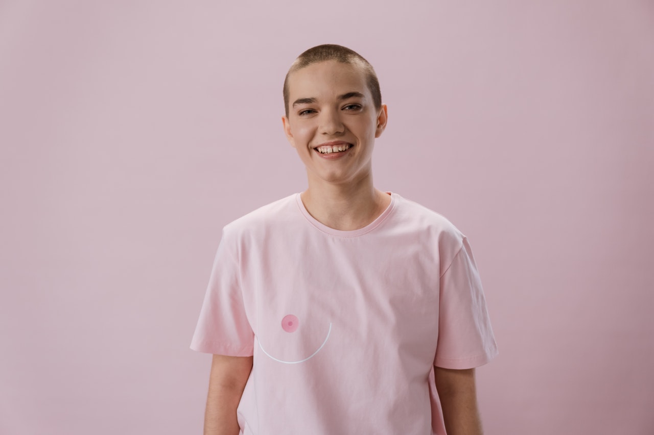 Woman Wearing Pink Shirt | Kids Car Donations