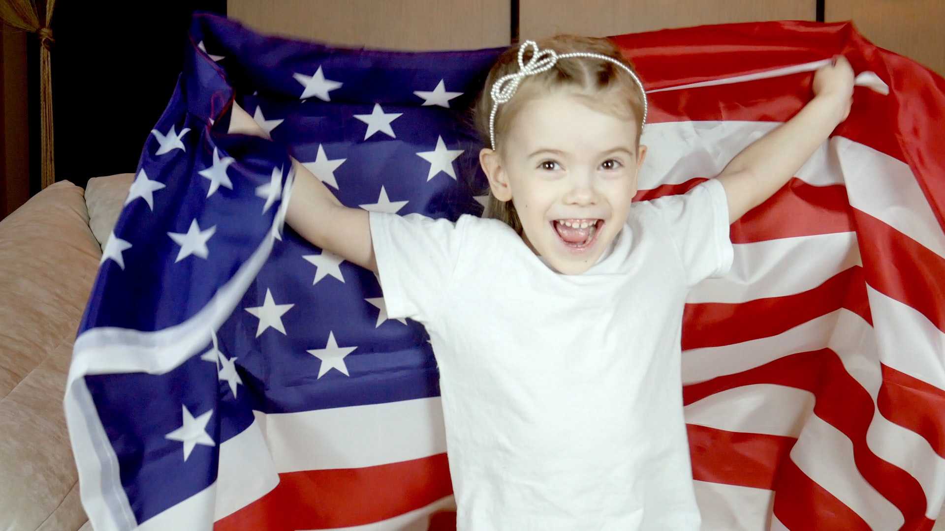 Kid Holding the US Flag | Kids Car Donations