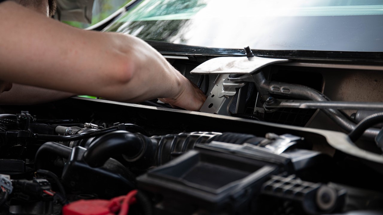 Man fixing a vehicle | Kids Car Donations