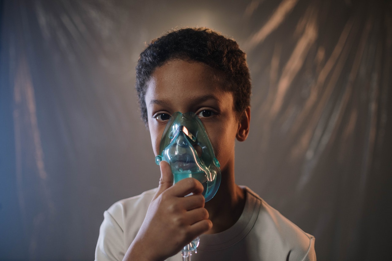 Boy Holding Oxygen Mask | Kids Car Donations