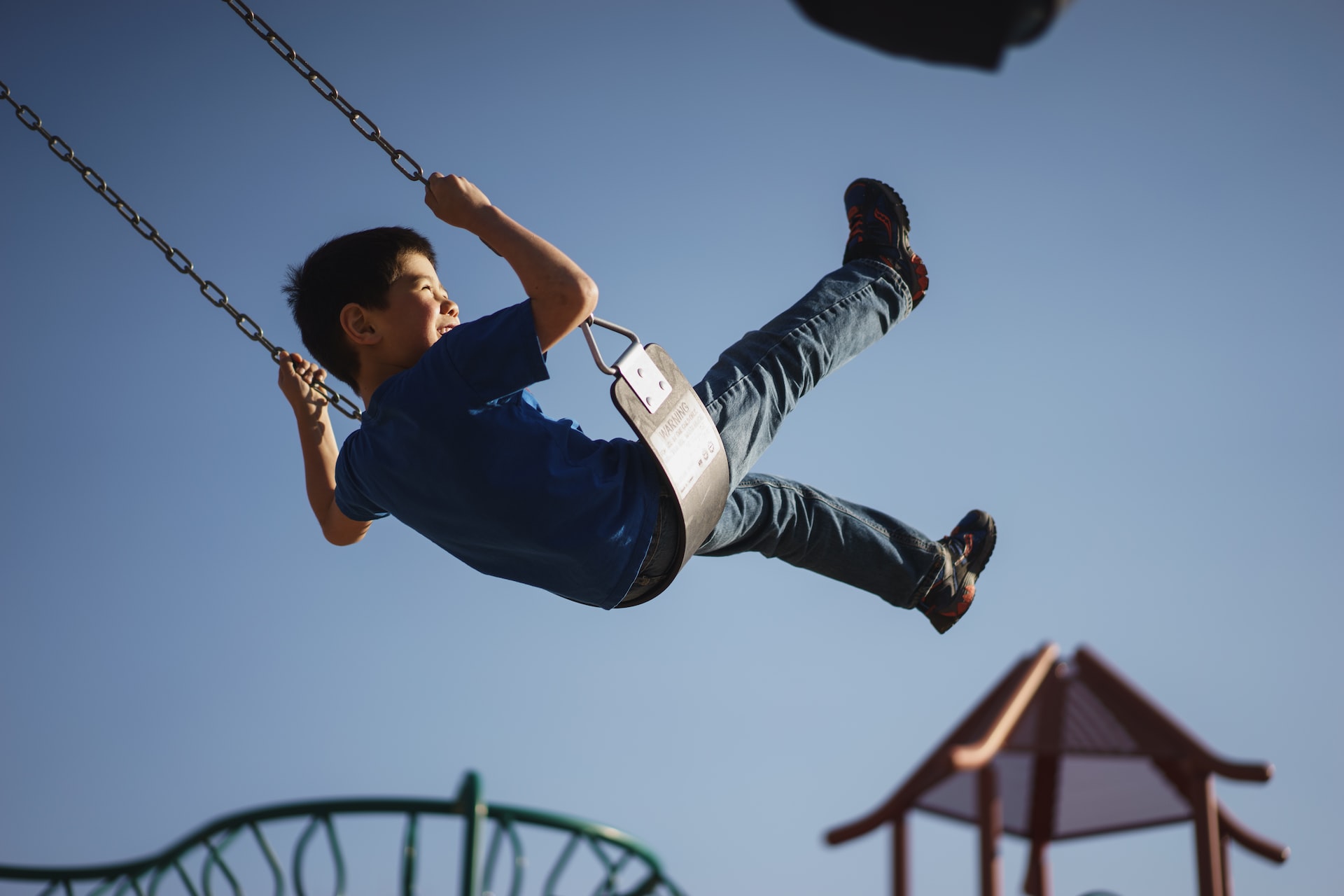 Boy Sitting on the Swing | Kids Car Donations