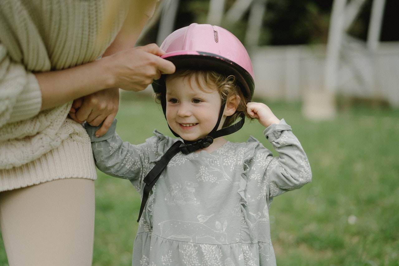 Kid Wearing Pink Helmet | Kids Car Donations