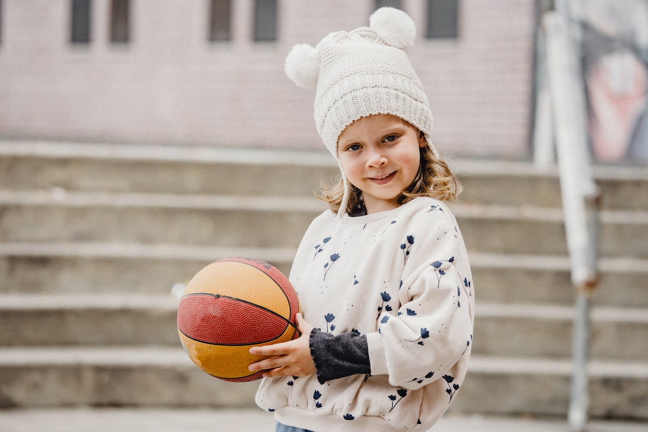 Cute girl with ball | Kids Car Donations