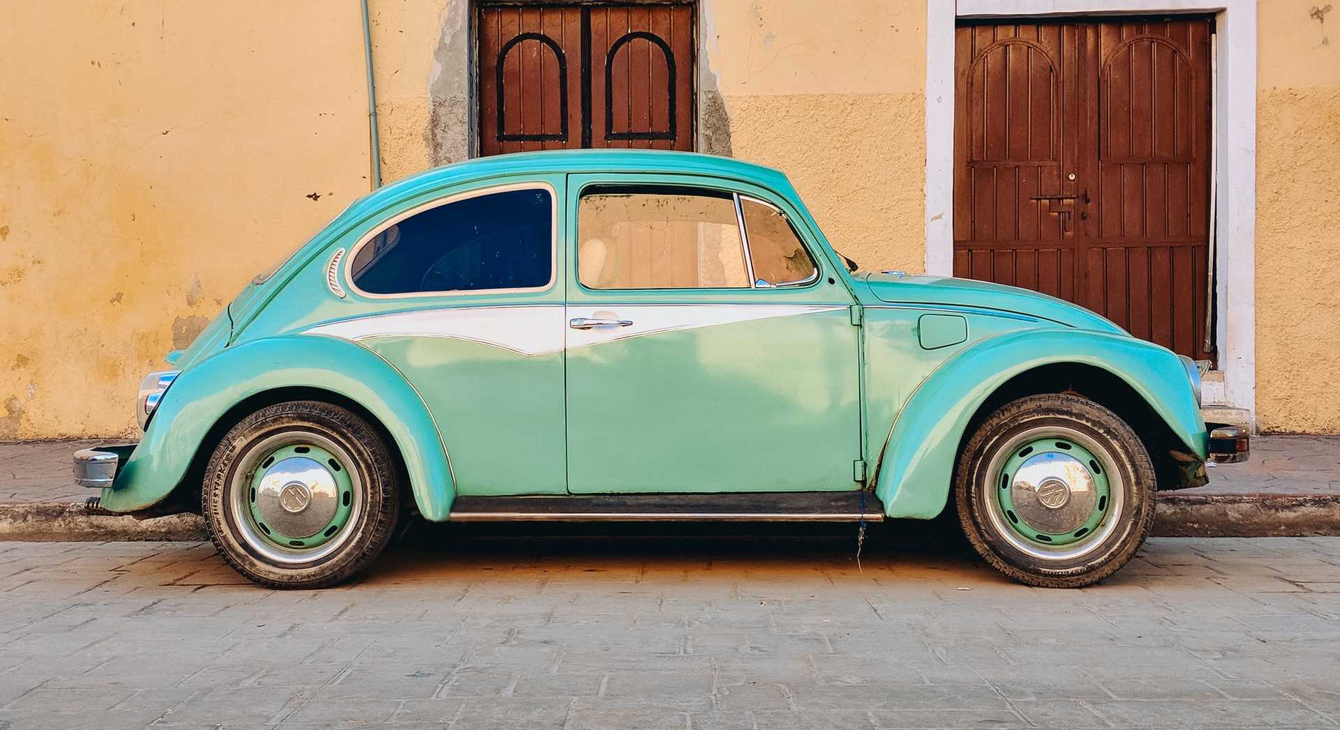 Teal Volkswagen Beetle Parked | Kids Car Donations