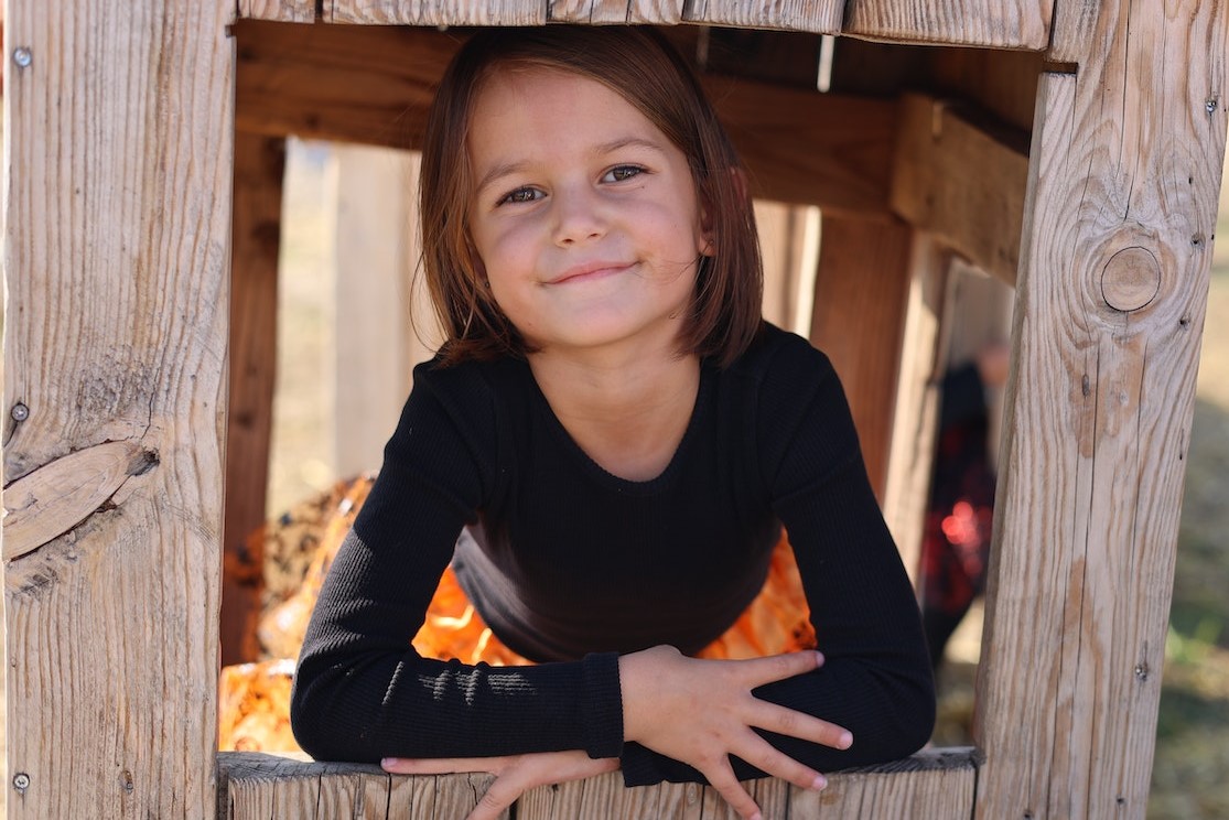 A Girl Inside a Wooden Toy House | Kids Car Donations