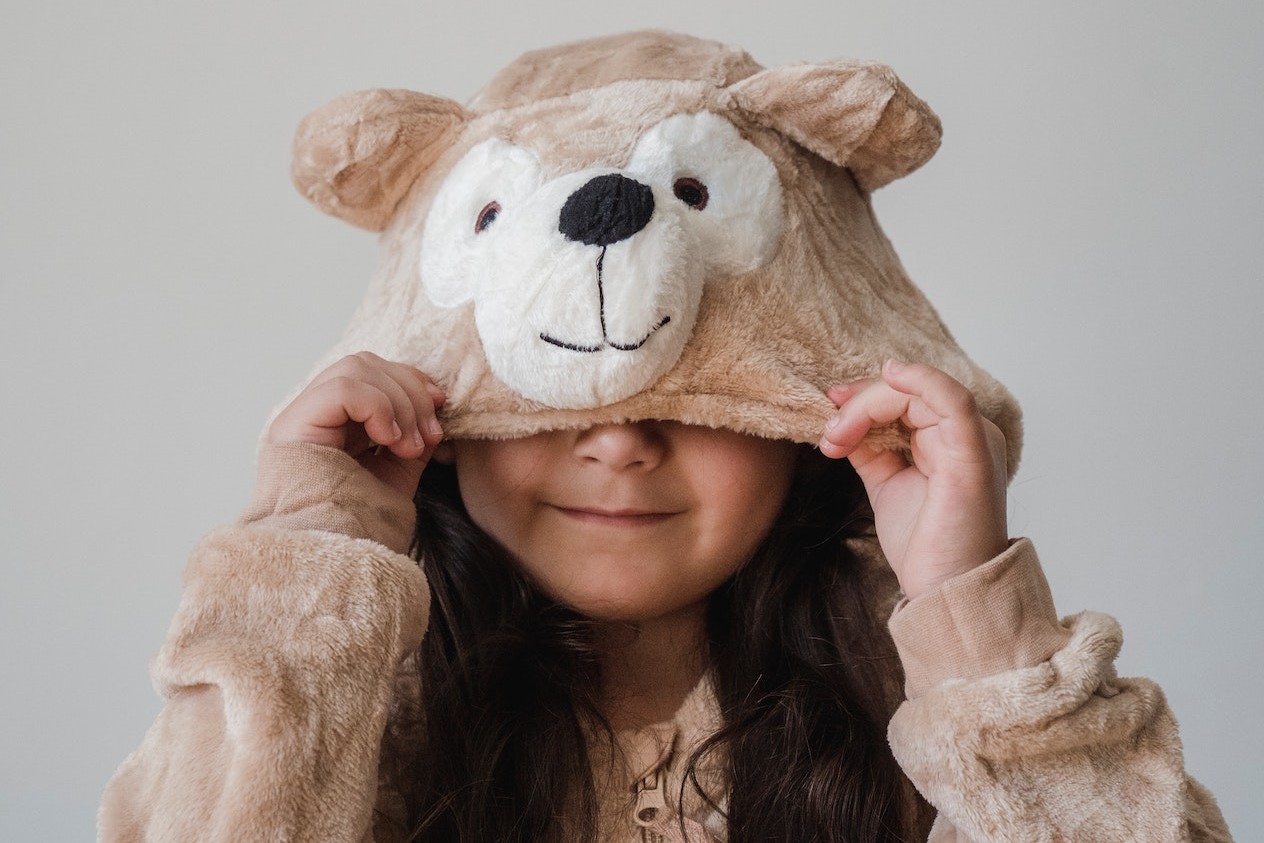 A Girl Wearing a Bear Costume | Kids Car Donations