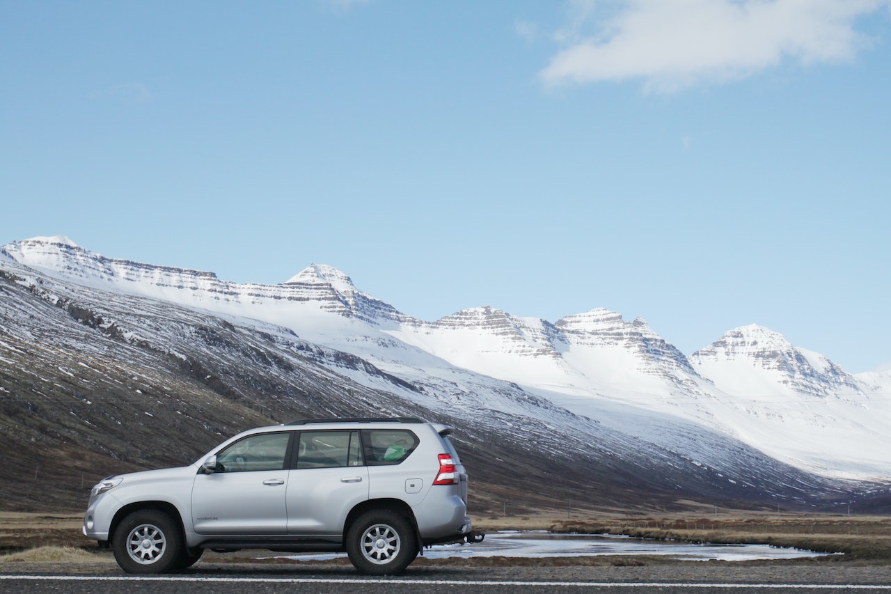 Gray Sports Utility Vehicle on Road Near Snow | Kids Car Donations