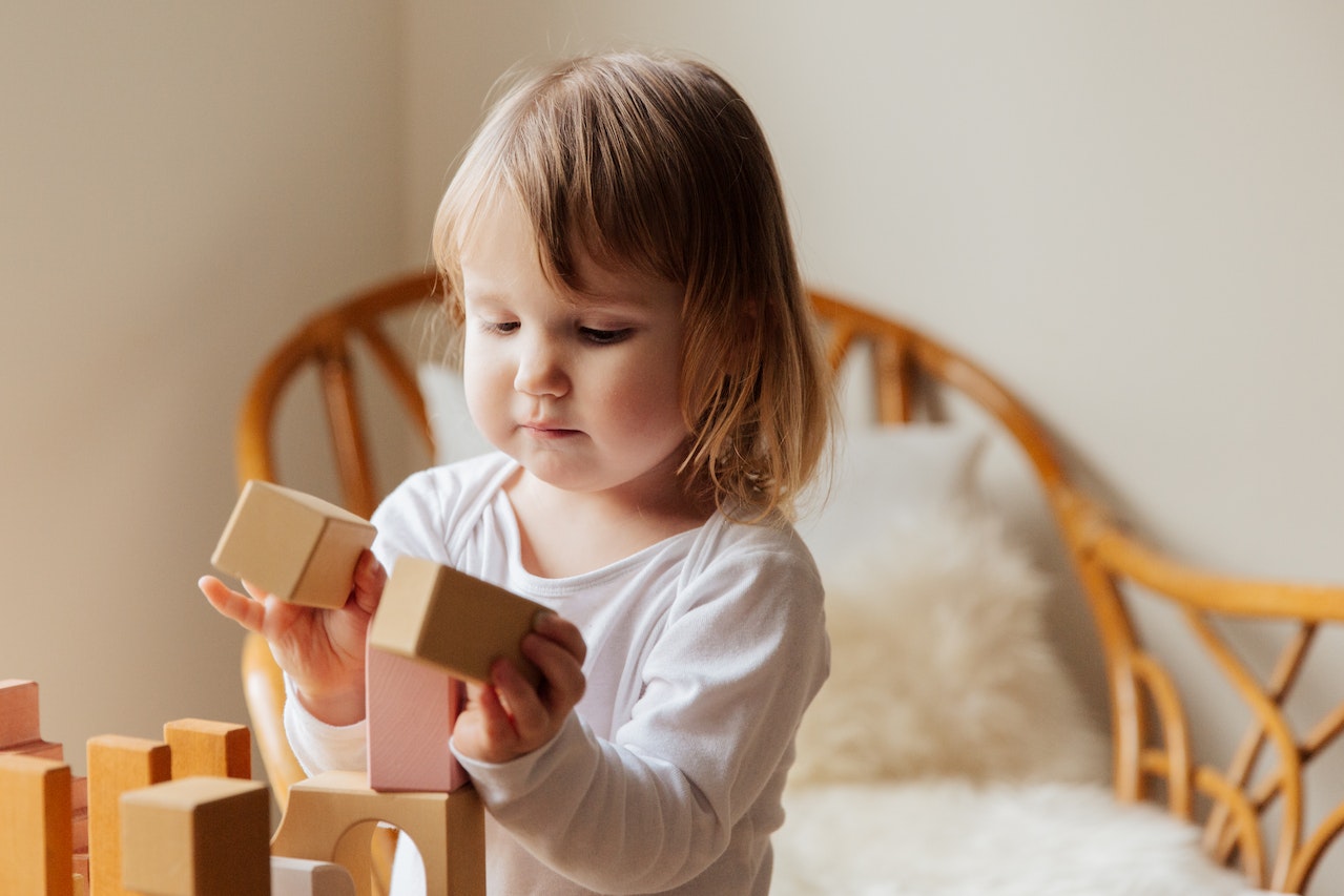 Photo Of Child Playing Wooden Blocks | Kids Car Donations