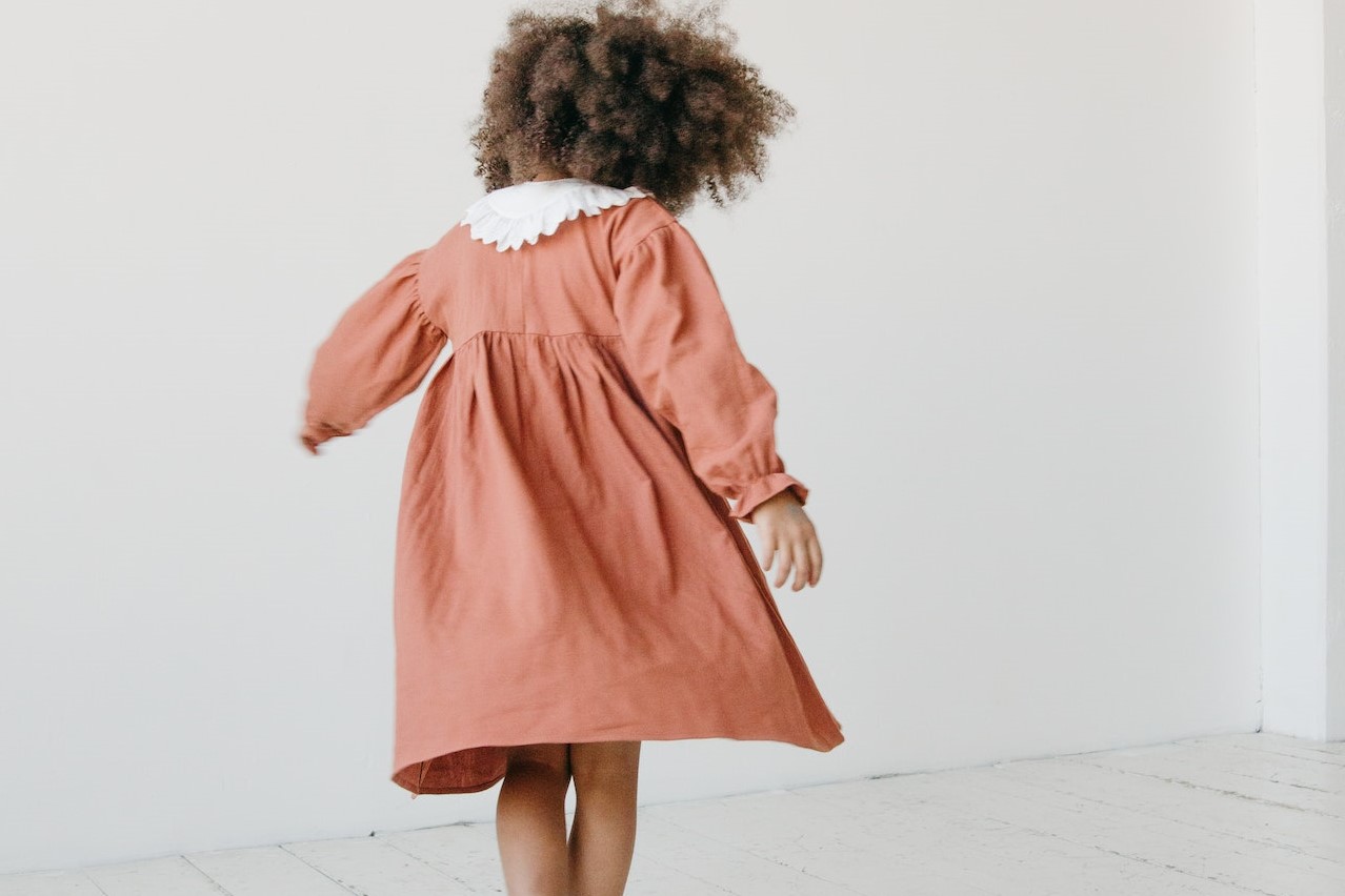 Girl Walking on White Wooden Floor | Kids Car Donations