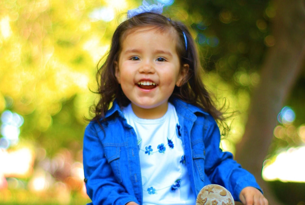 Girl Wearing a Blue Jacket | Kids Car Donations