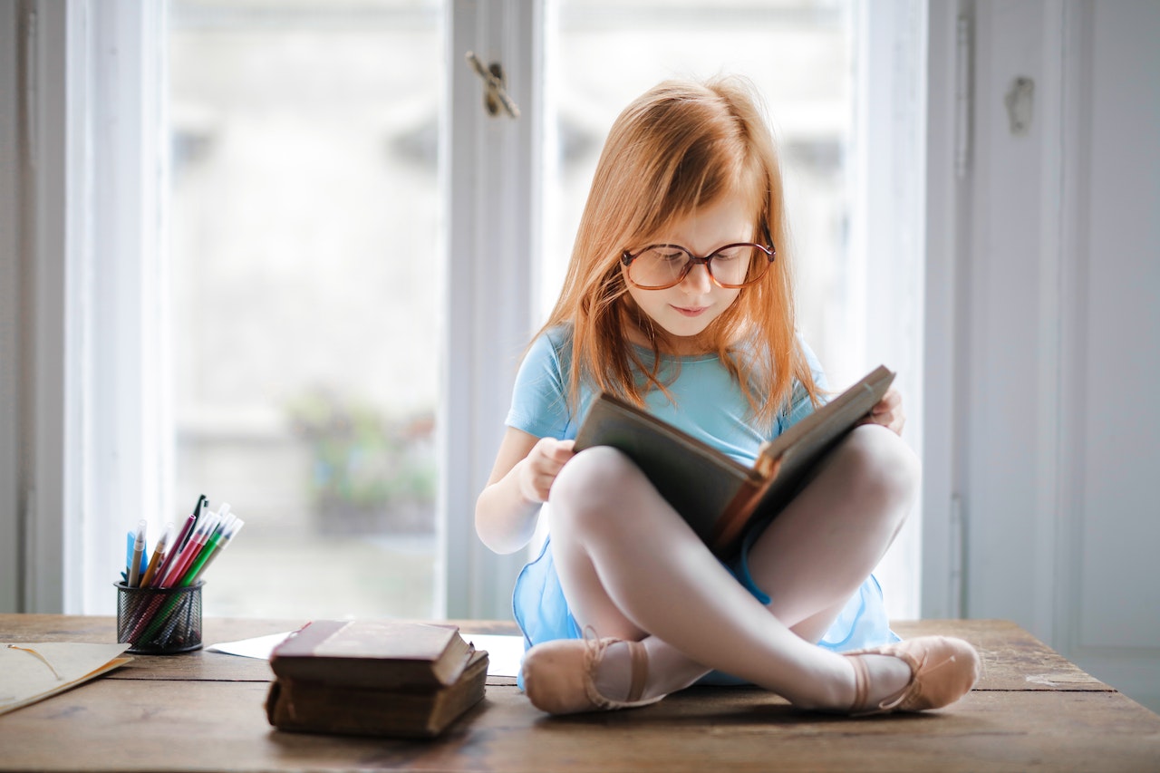 Photo Of Girl Reading Book | Kids Car Donations