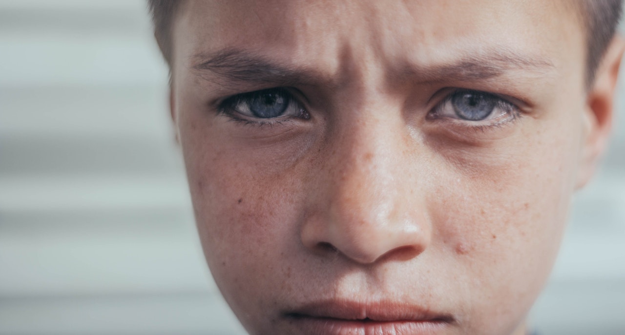 Close-up Photo of Sad Boy's Face | Kids Car Donations