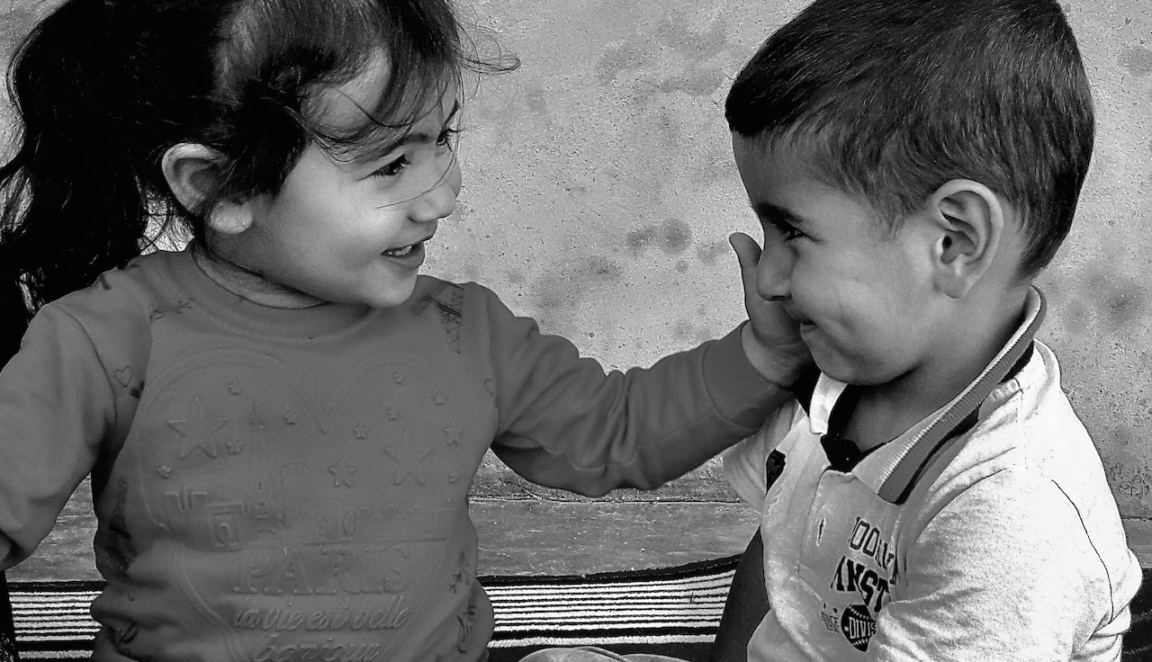 Grayscale Photo of Two Adorable Children | Kids Car Donations