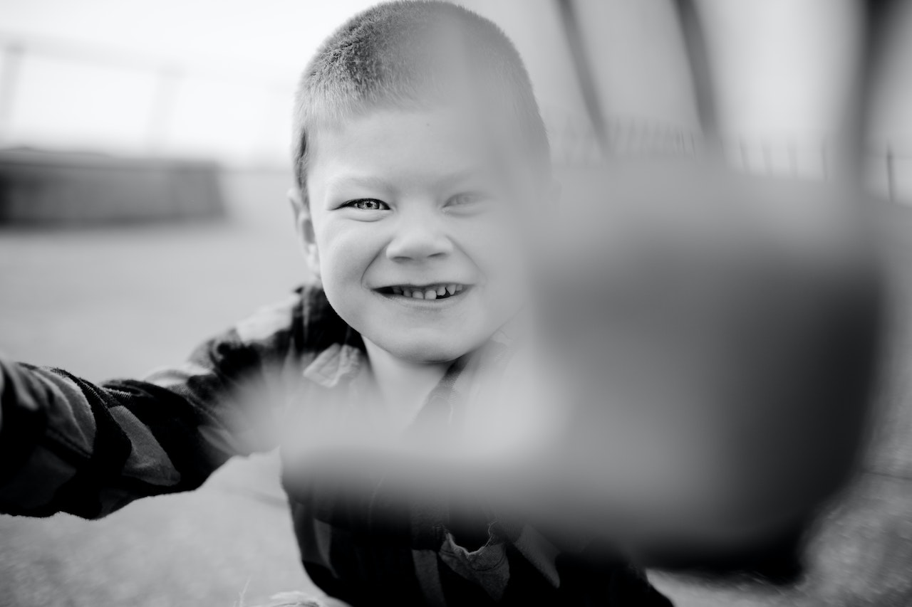 Grayscale Photo of a Kid | Kids Car Donations