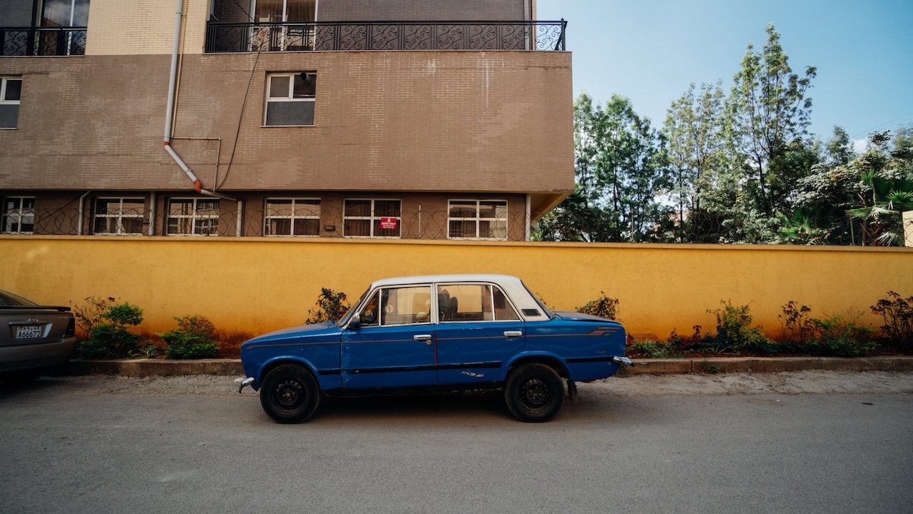 Photo Of Blue Sedan On Street | Kids Car Donations