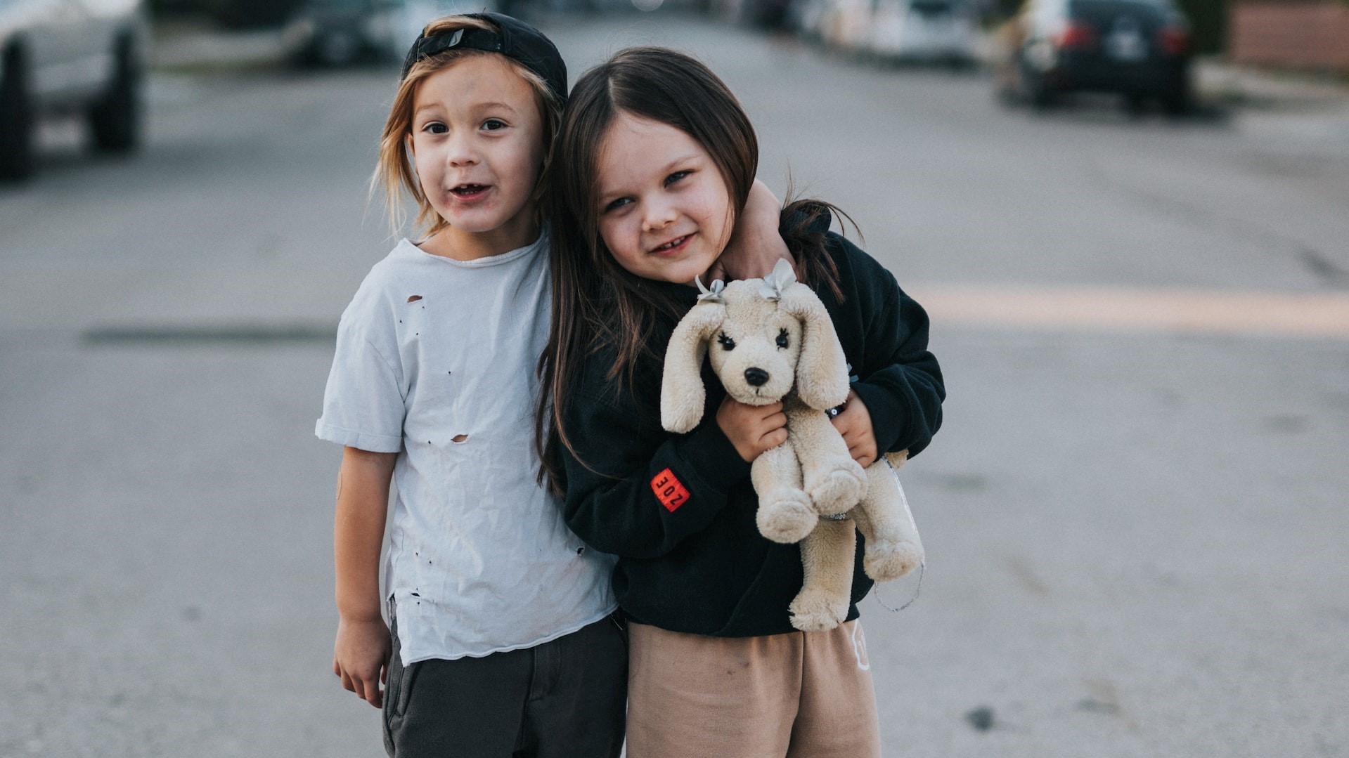 Two kids on the middle of the road | Kids Car Donations