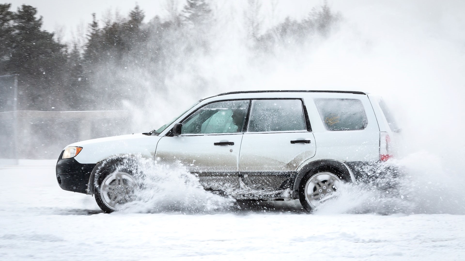 White suv on a snowy road | Kids Car Donations