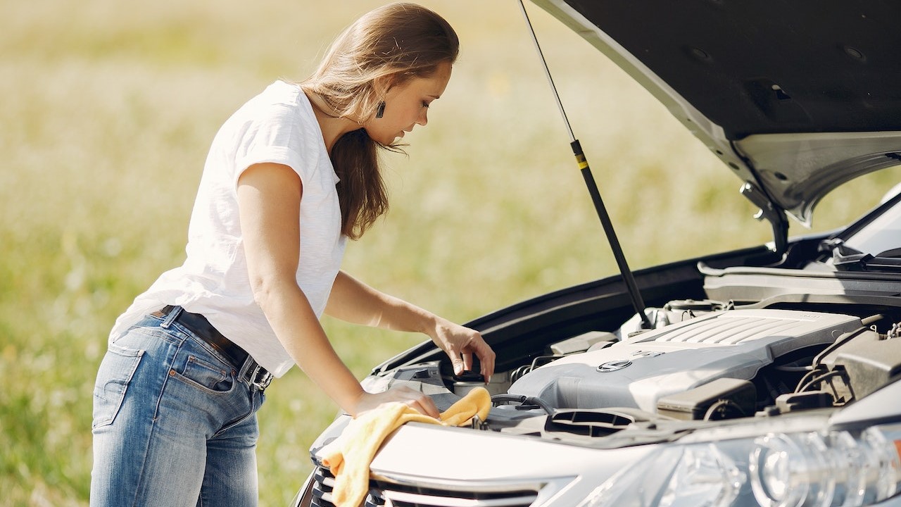 Woman checking her car | Kids Car Donations