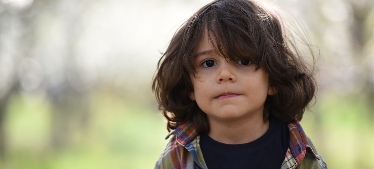 Boy Facing Camera Selective Focus Photography | Kids Car Donations