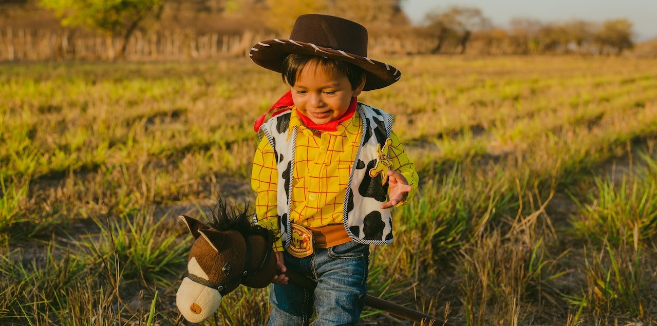 Child Wearing a Costume Walking on Grass Field | Kids Car Donations