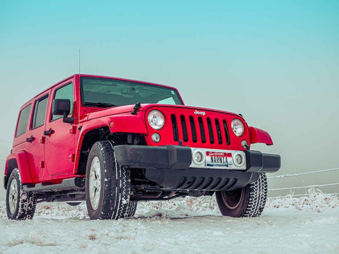 Red Suv on Snow Covered Grounds | Kids Car Donations