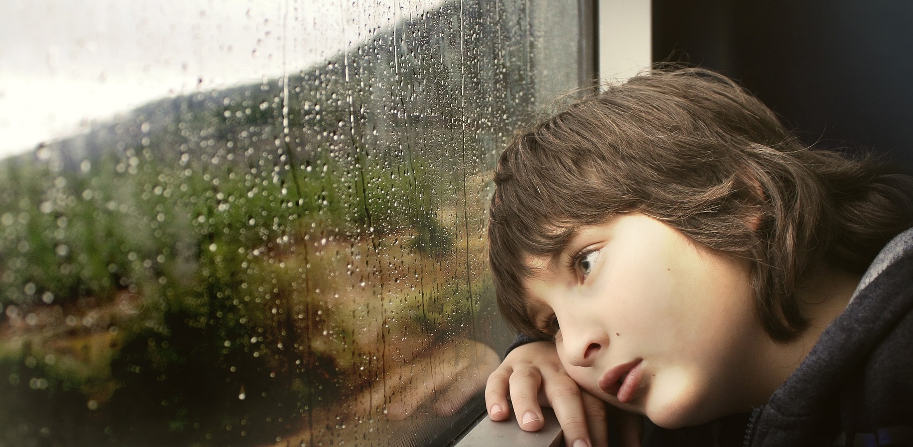 sad kid on window | Kids Car Donations