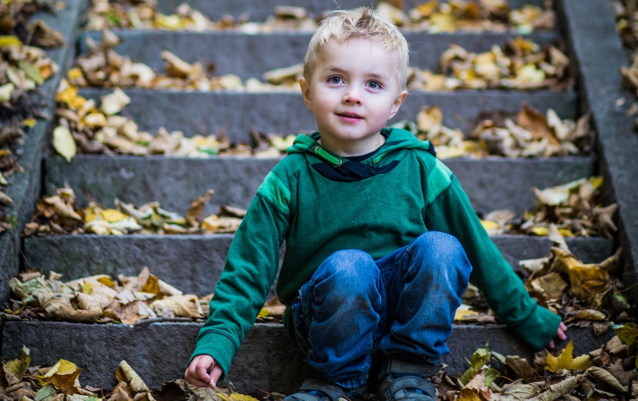 Boy Sitting On Stairs | Kids Car Donations