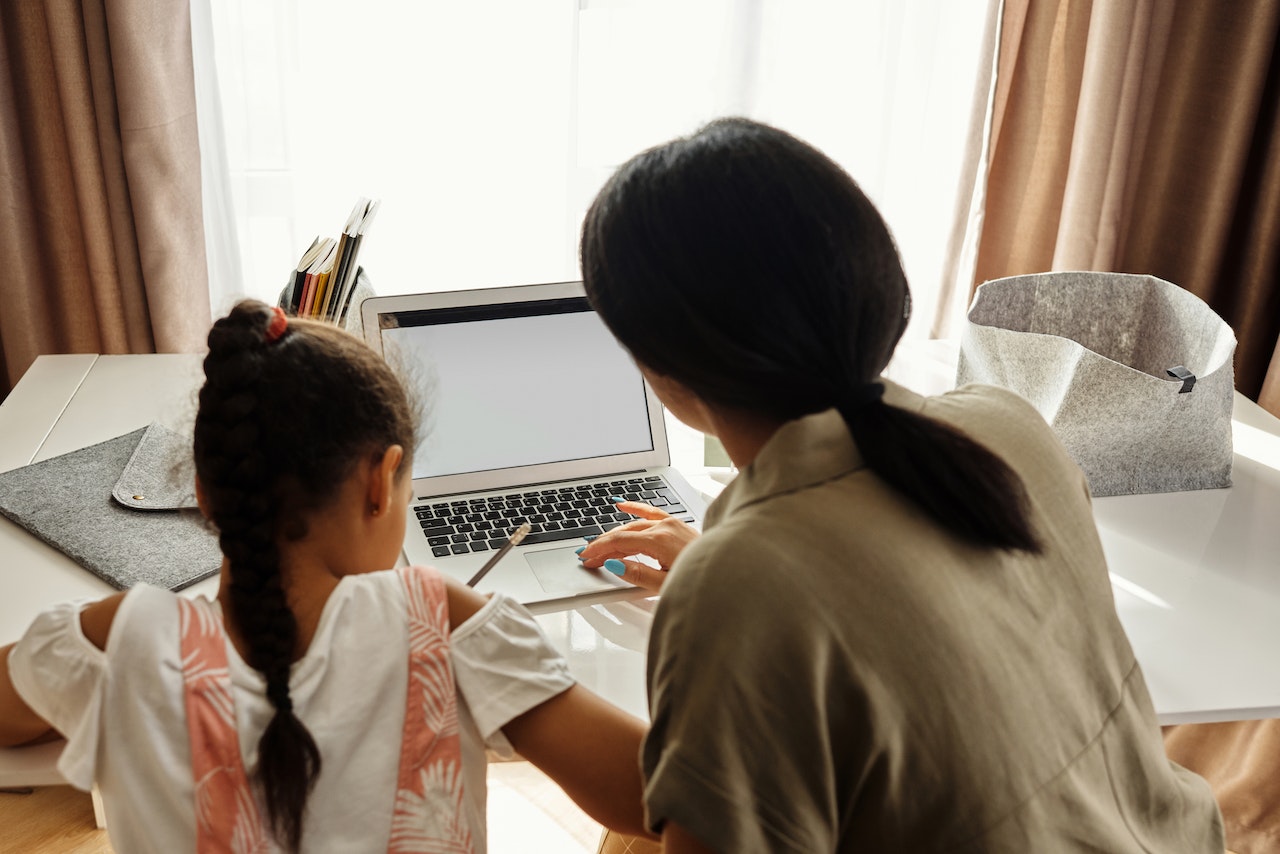 Mother Helping her Daughter with Homework | Kids Car Donations