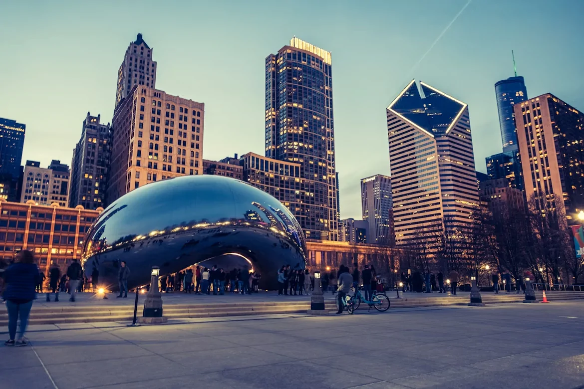 Group of people standing around Cloud Gate (The Bean) in Millennium Park, Chicago