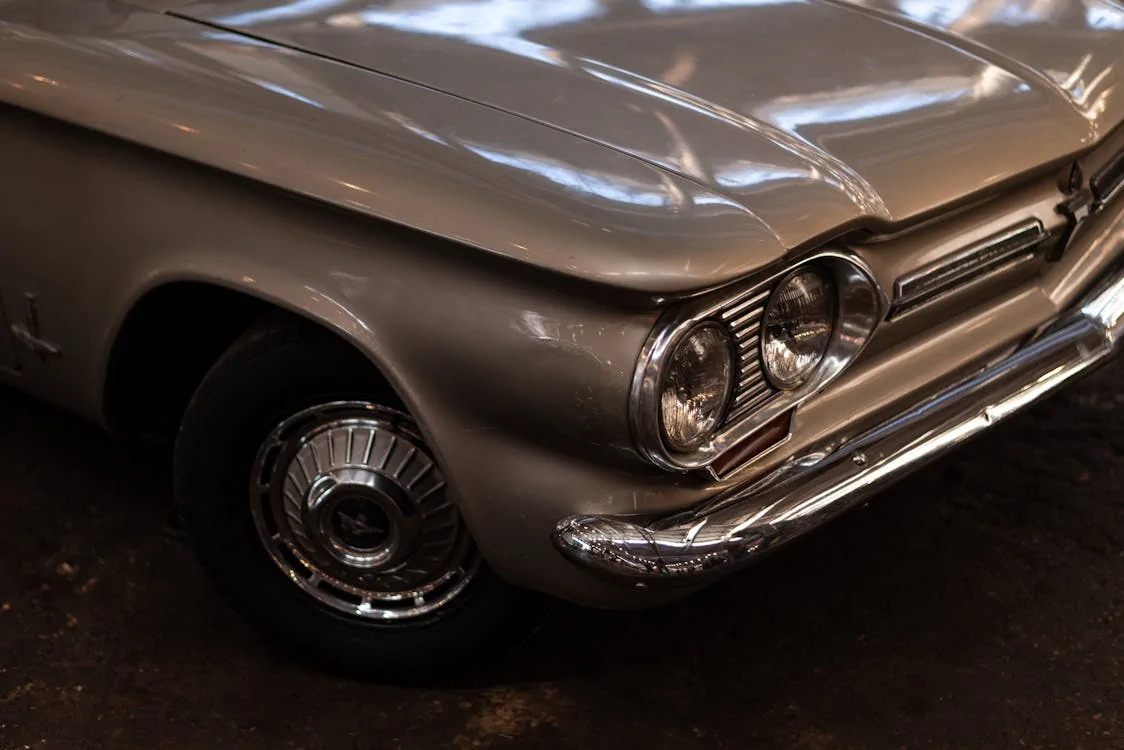 Brown Chevrolet Corvair Monza in close-up photography