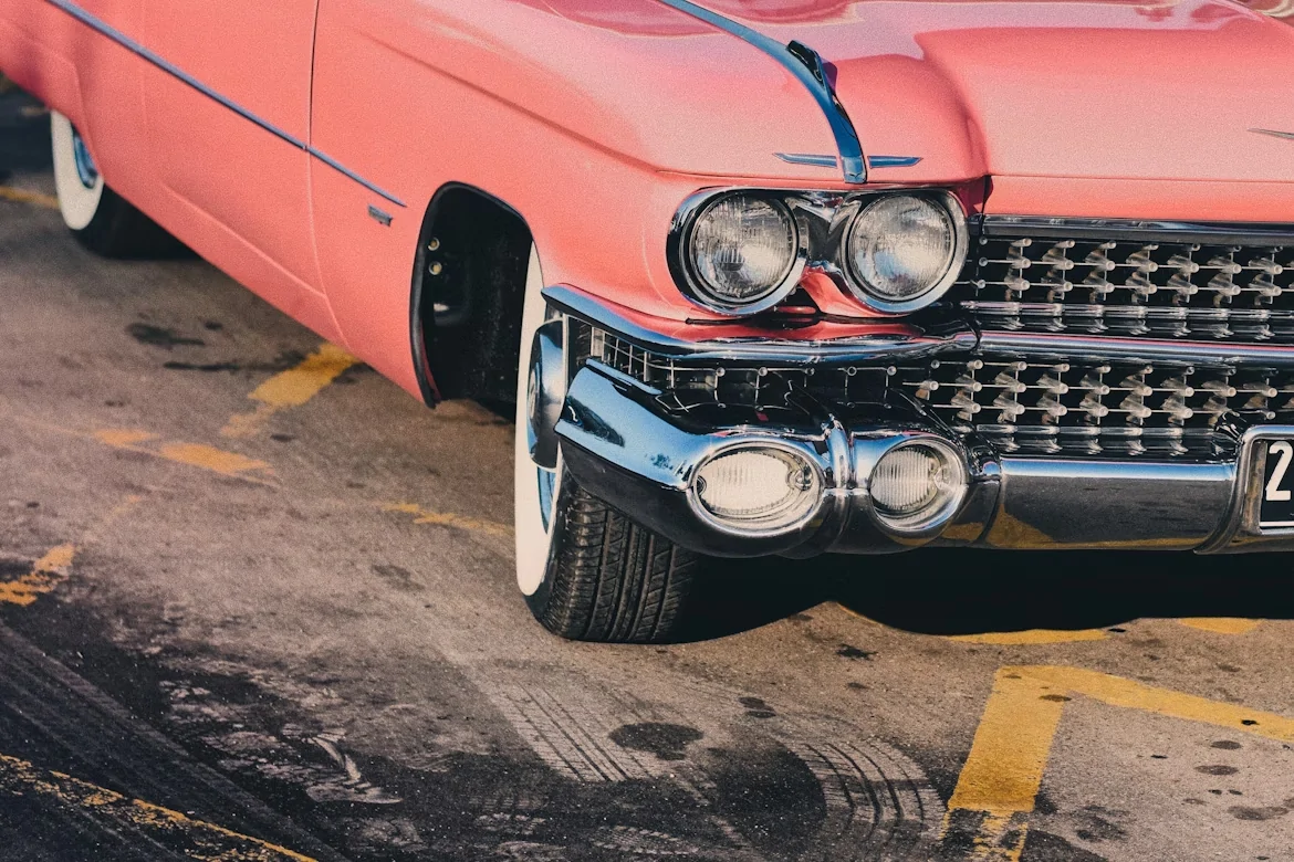 Close-up photography of a pink classic Chevrolet