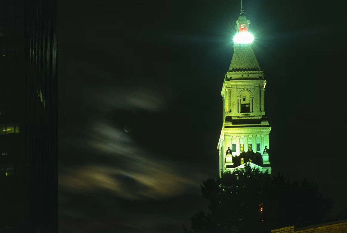 Clock tower lit up at night in Hartford, Connecticut