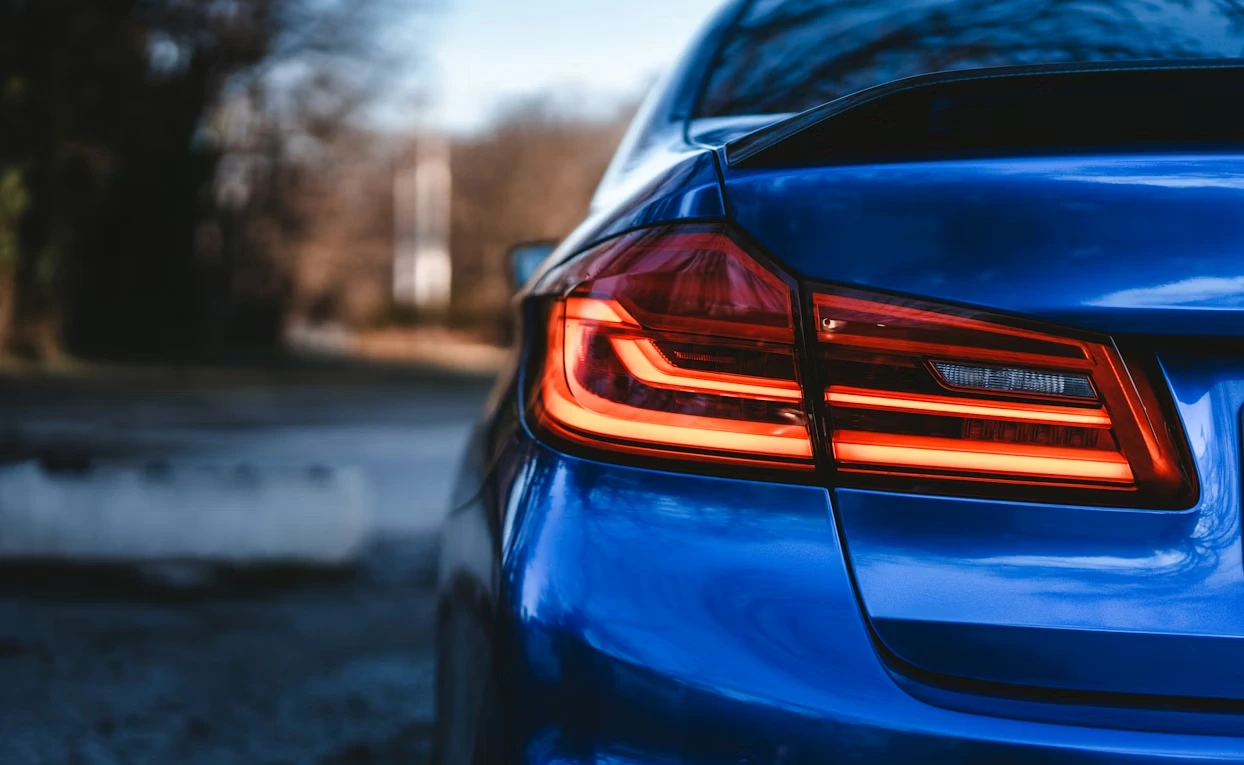 Close-up of the tail lights of a blue BMW in Sofia, Bulgaria