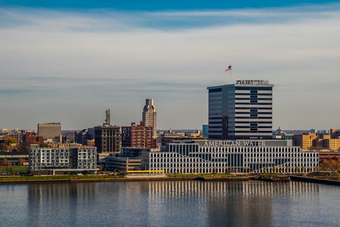 A large body of water with the skyline of Camden, New Jersey in the background
