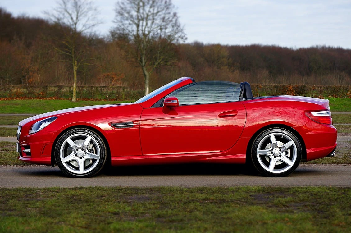 Red Mercedes-Benz SLK350 convertible parked outdoor