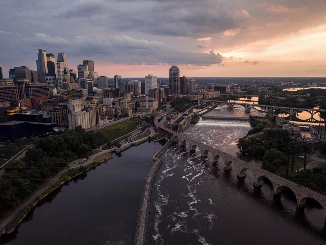 erial shot of concrete structures near body of water in Minneapolis, Minnesota