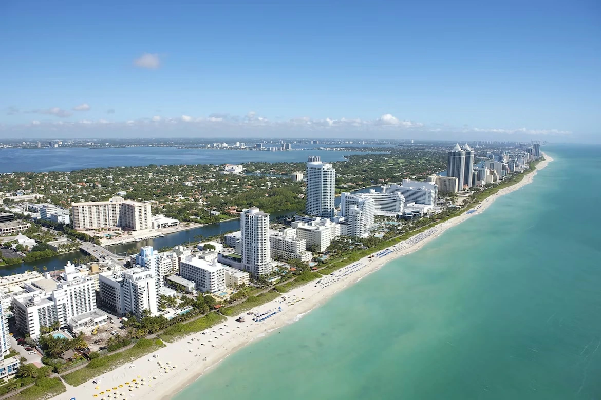 Aerial view of city buildings near a body of water during daytime in Miami Beach, Florida