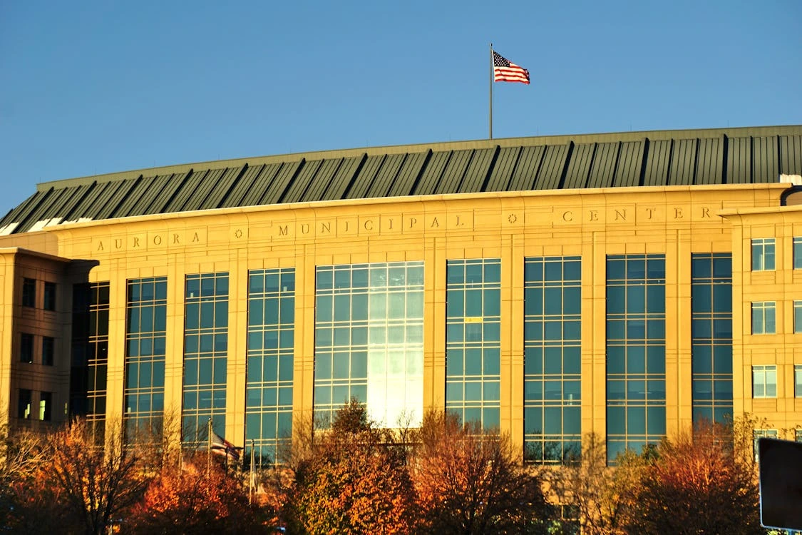 Aurora Municipal Center with American flag in Aurora, Colorado