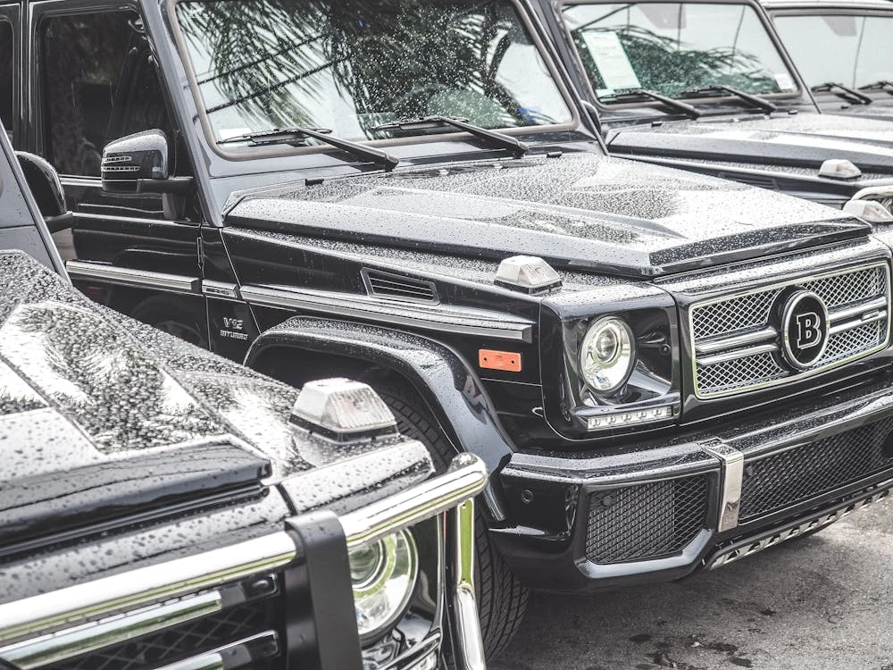 Black cars on gray concrete road