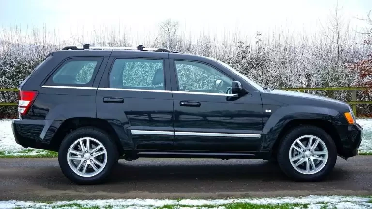 Black SUV on winter road
